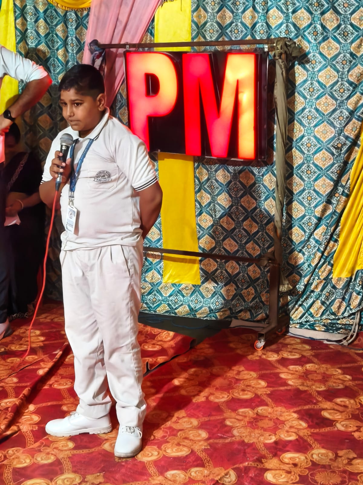 Student in school uniform on stage