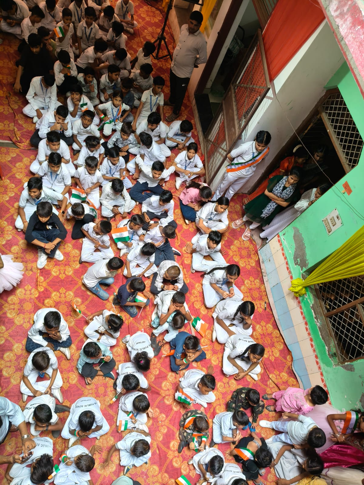 Students seated together during Independence Day assembly